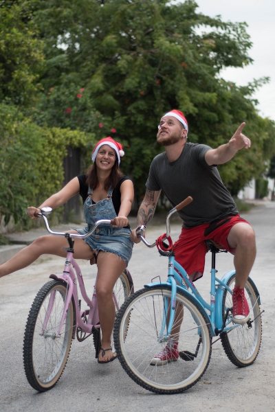 Us on baby blue and pink bikes with Xmas hats 